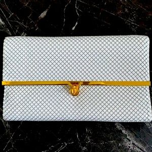 Mesh clutch bag with strap and clasp closure